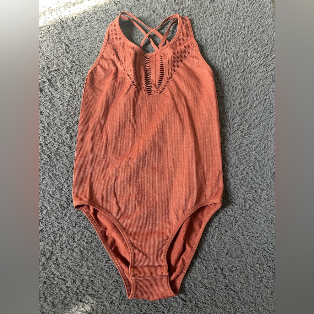 Ribbed size small rust colored bodysuit strappy lazer cut